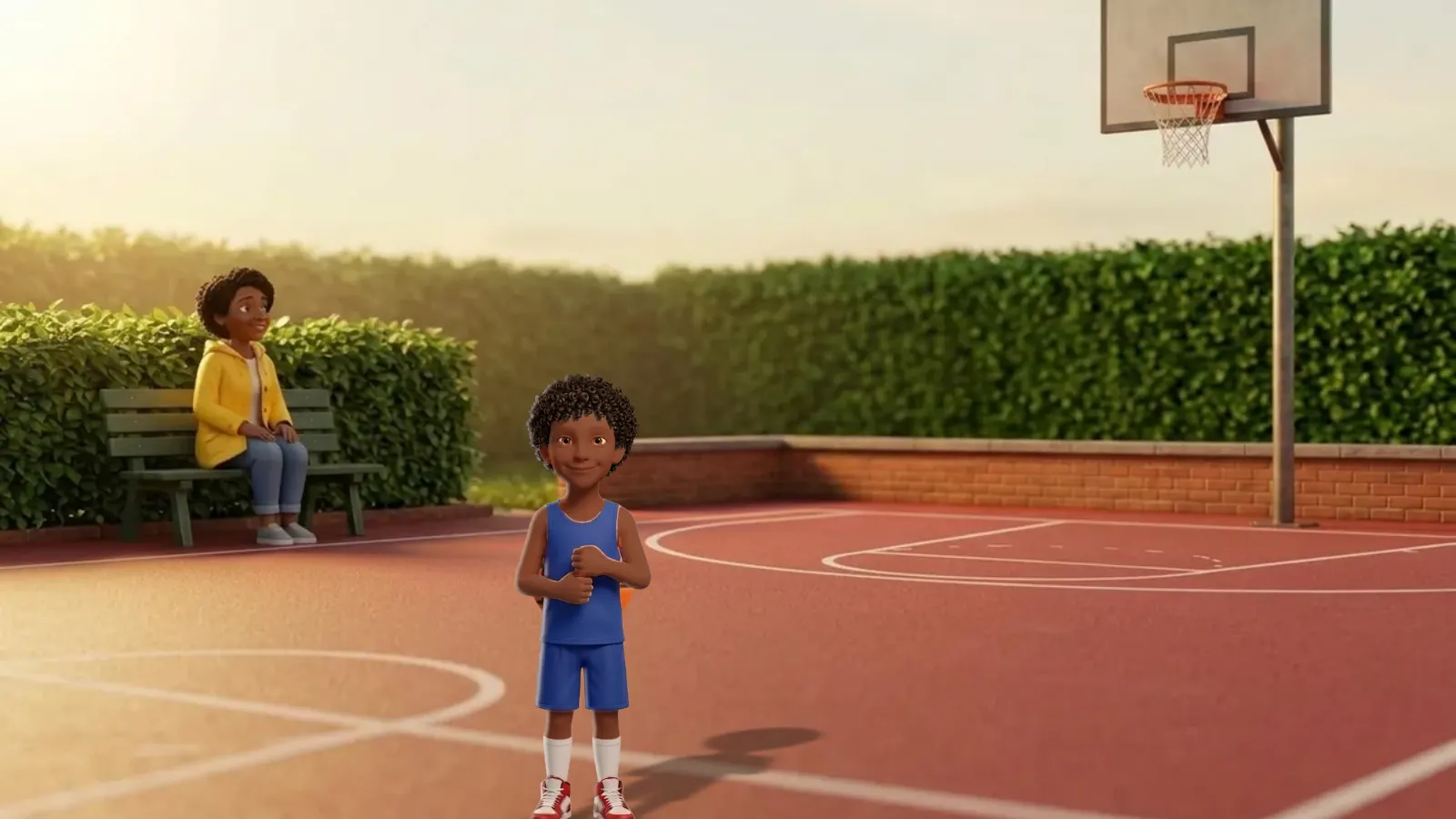 A smiling boy in a blue basketball uniform stands on an outdoor court, with a hoop behind him and a girl in a yellow jacket on a bench by the hedge.
